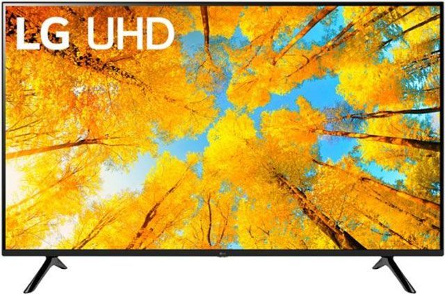 An lg uhd tv with a picture of trees on the screen
