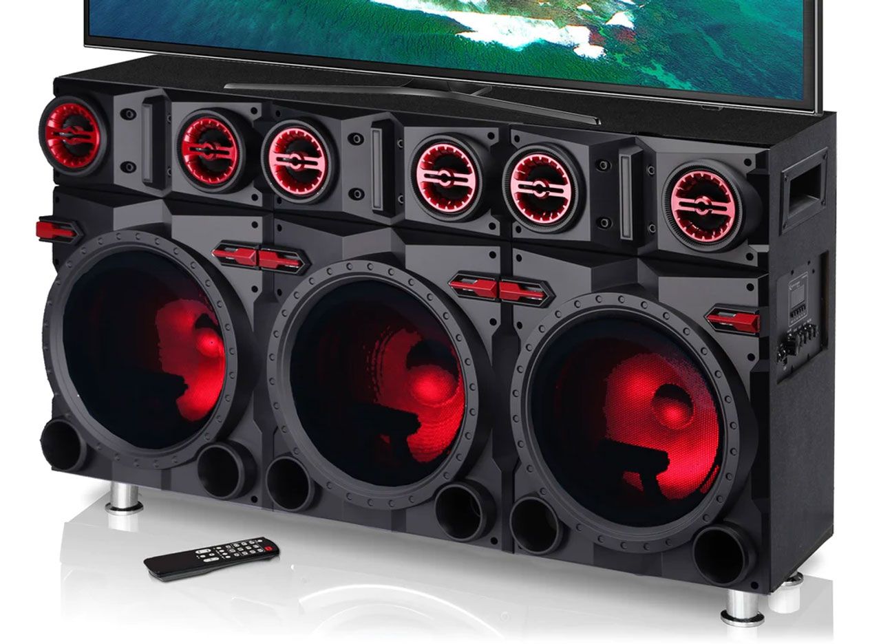 A tv is sitting on top of a speaker system