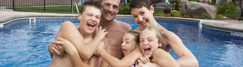 Family Enjoying in Swimming Pool