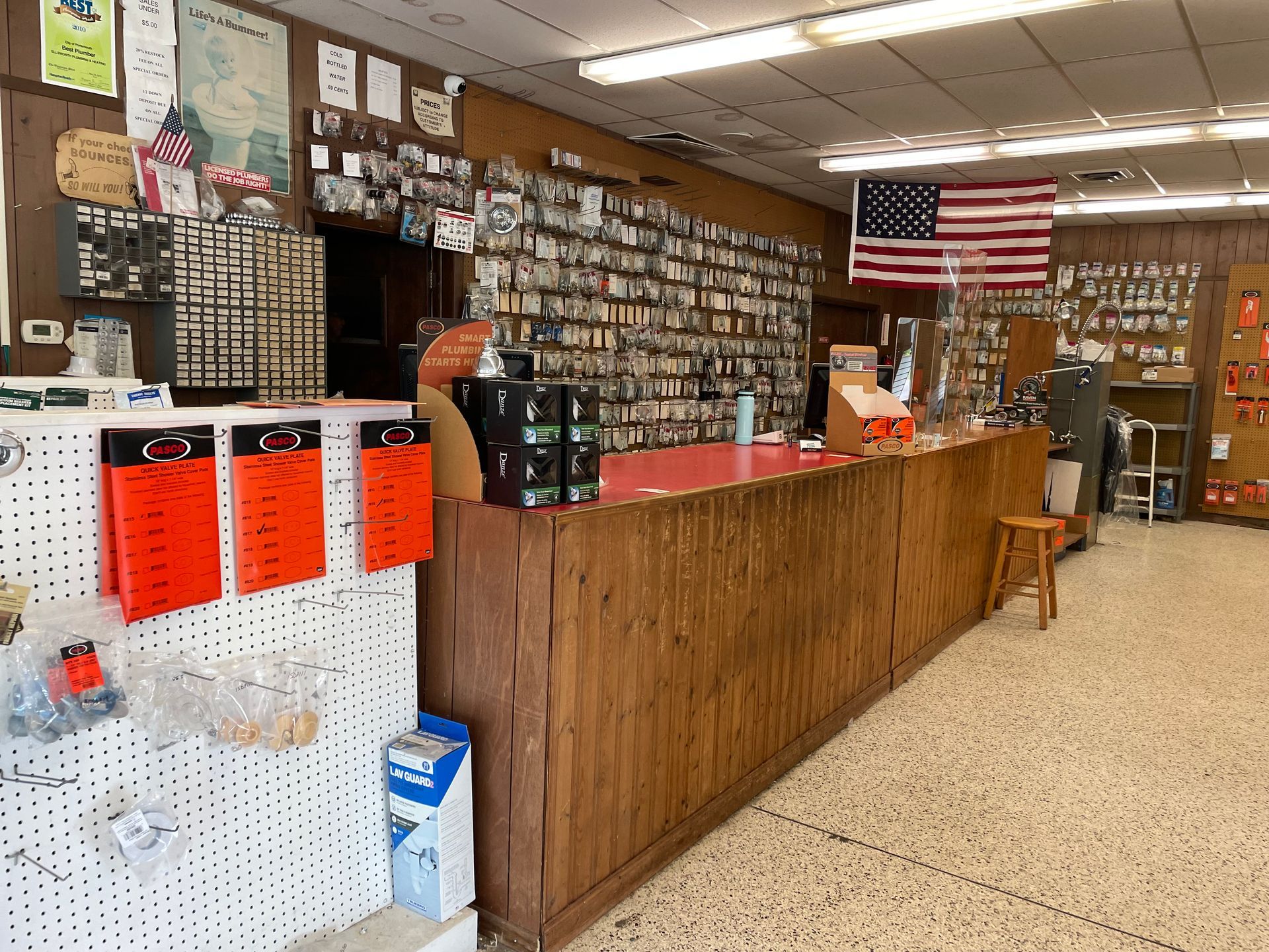 The inside of a store with an american flag on the wall