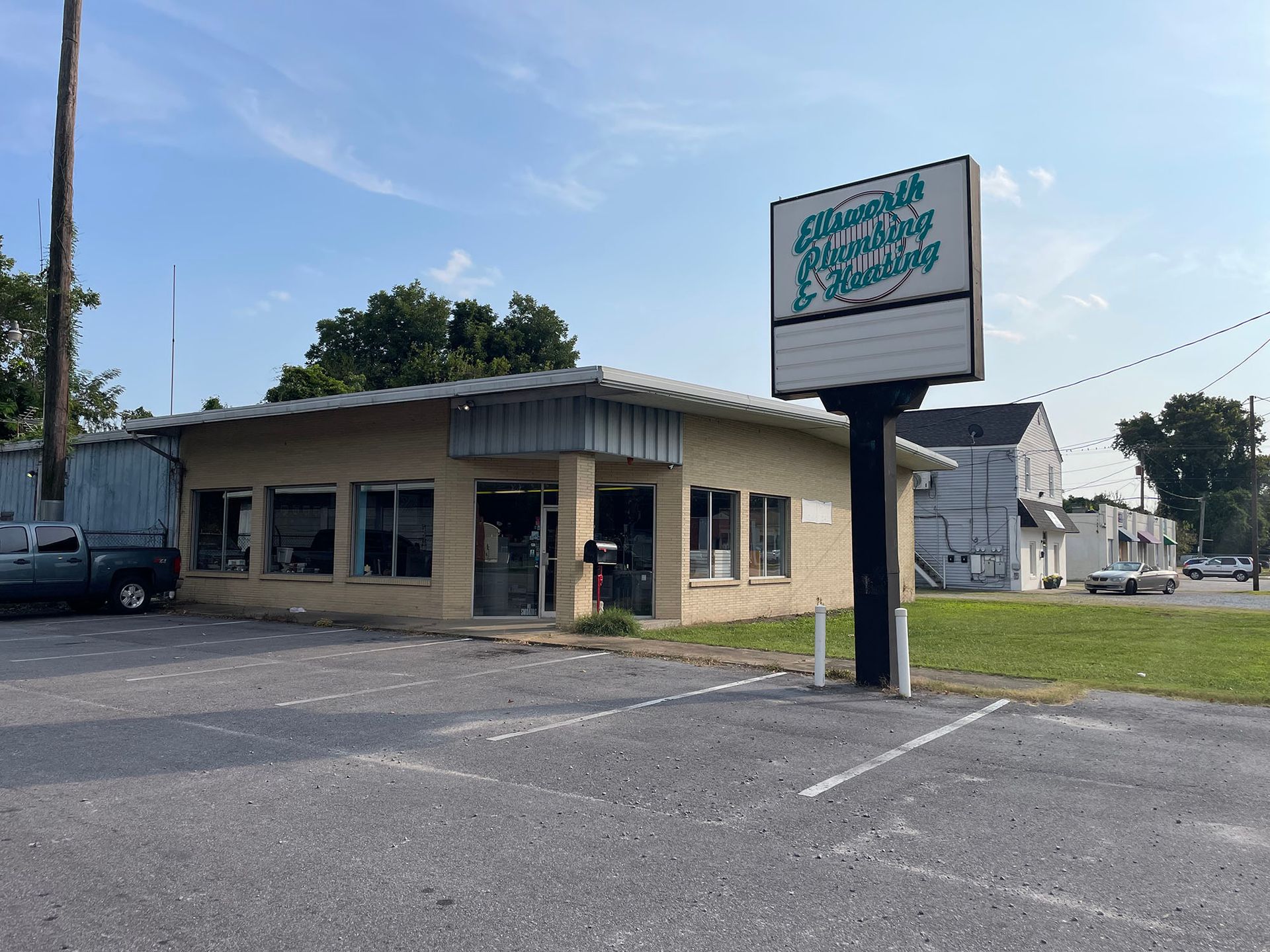 A large building with a large sign in front of it.