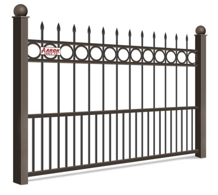 A wrought iron fence with a ball on top of it on a white background.