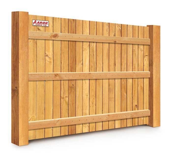 A wooden fence with the word arrow on it