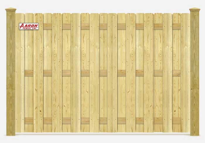 A wooden fence with a sign that says arrow on it
