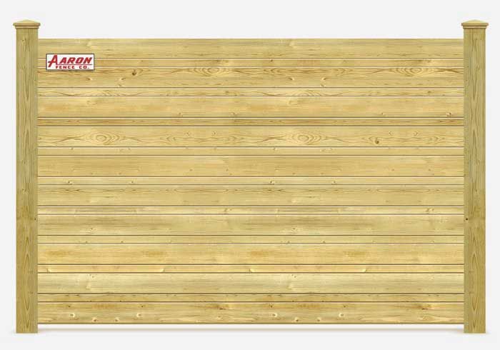 A wooden fence with a sign that says aaron on it