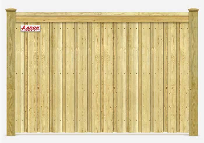 A wooden fence with a sign that says aaron on it.