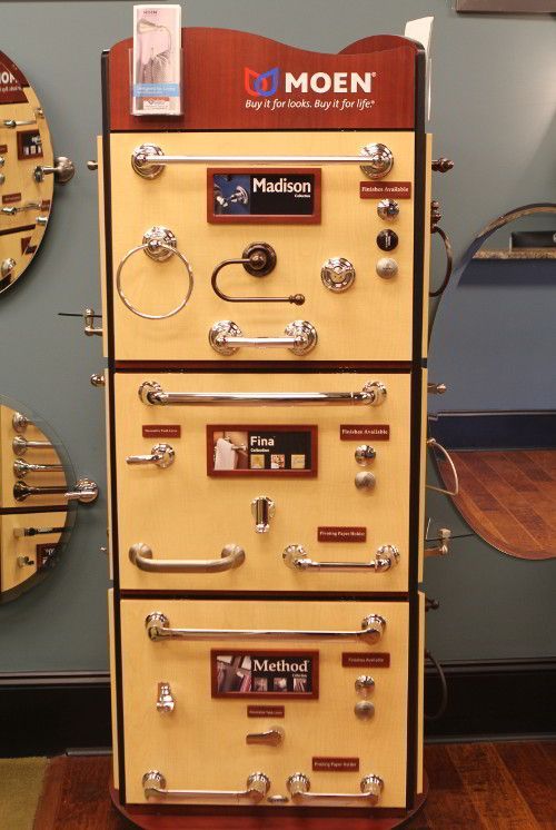 A display of moen hardware is stacked on top of each other