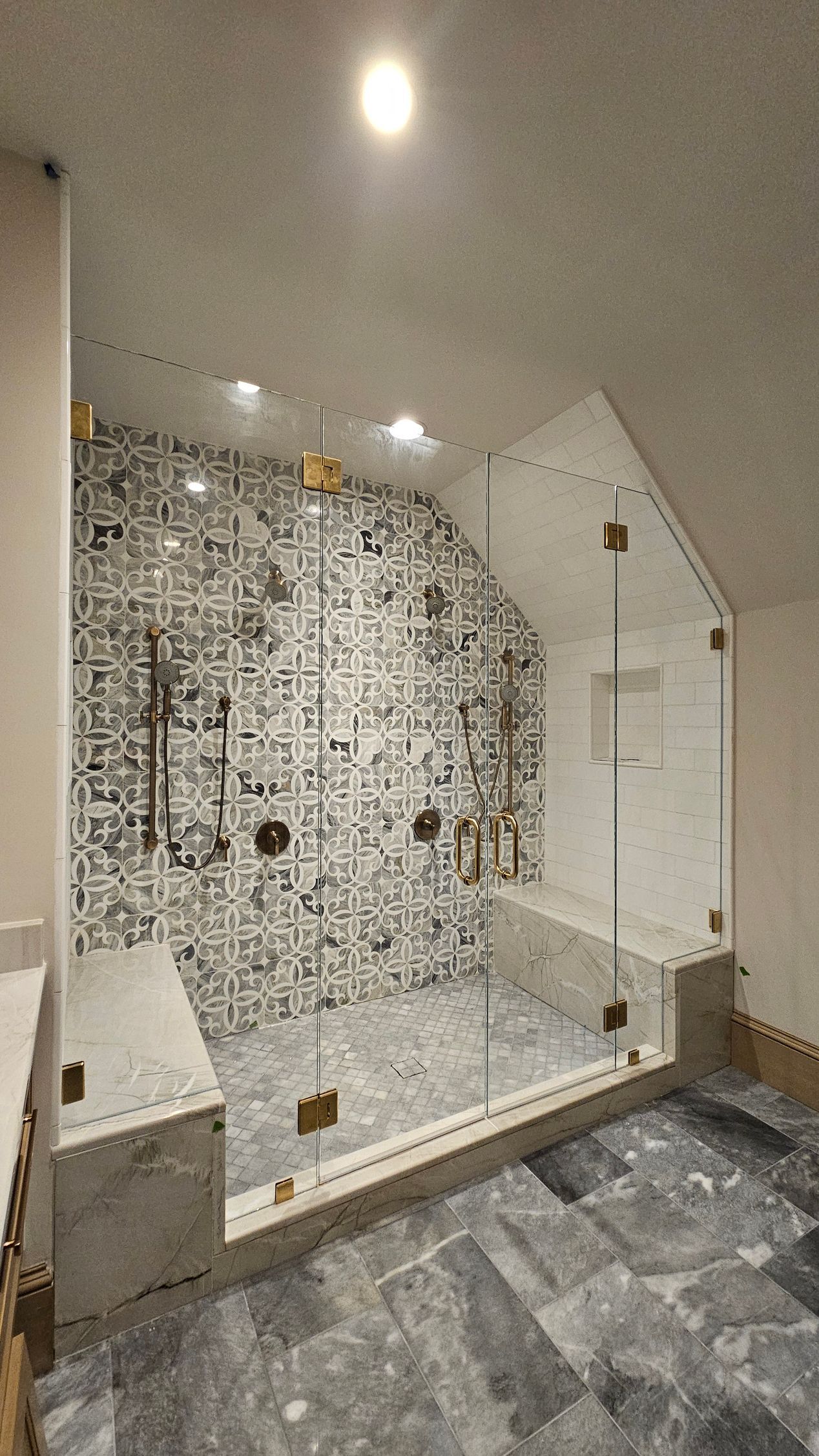 A bathroom with a walk in shower and a bathtub.