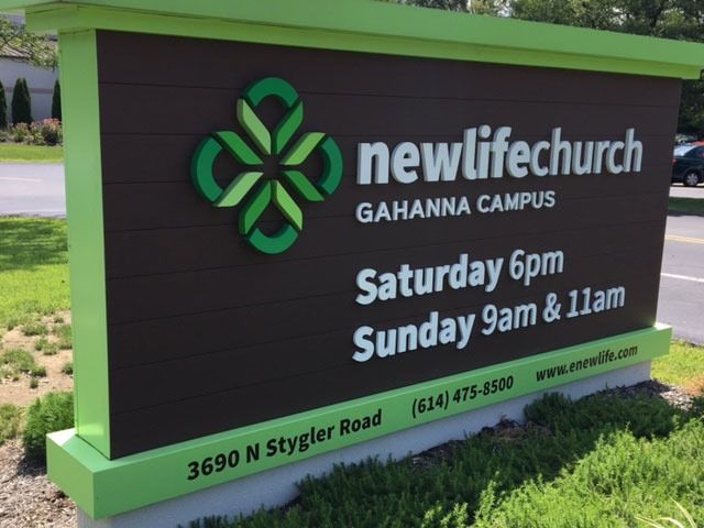 Sign for Newlife Church in Gahanna, Ohio with service times and contact info.