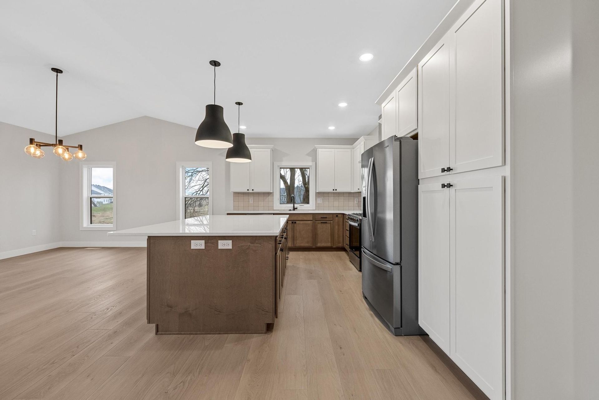 There is a large island in the middle of the kitchen.