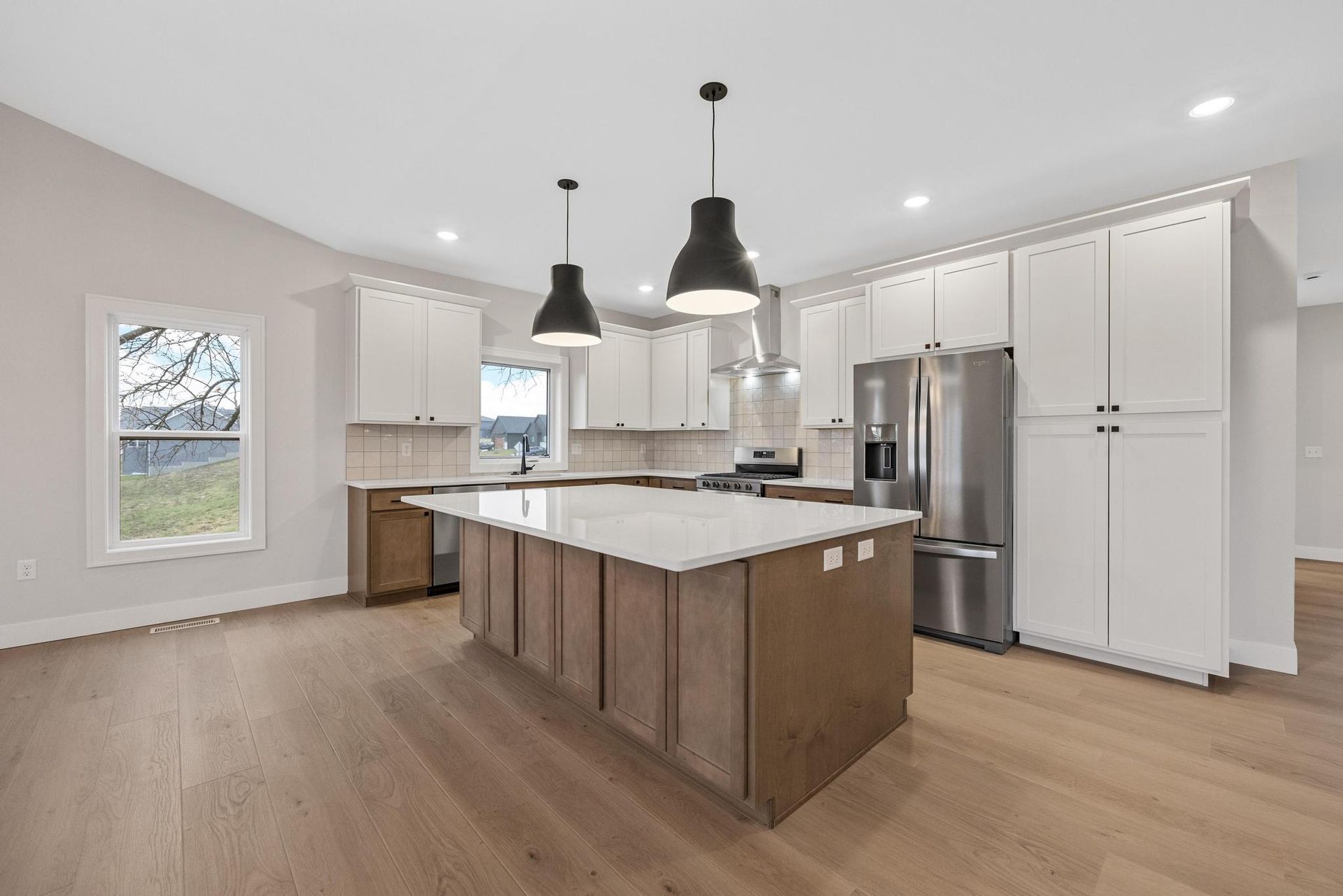 There is a large island in the middle of the kitchen.