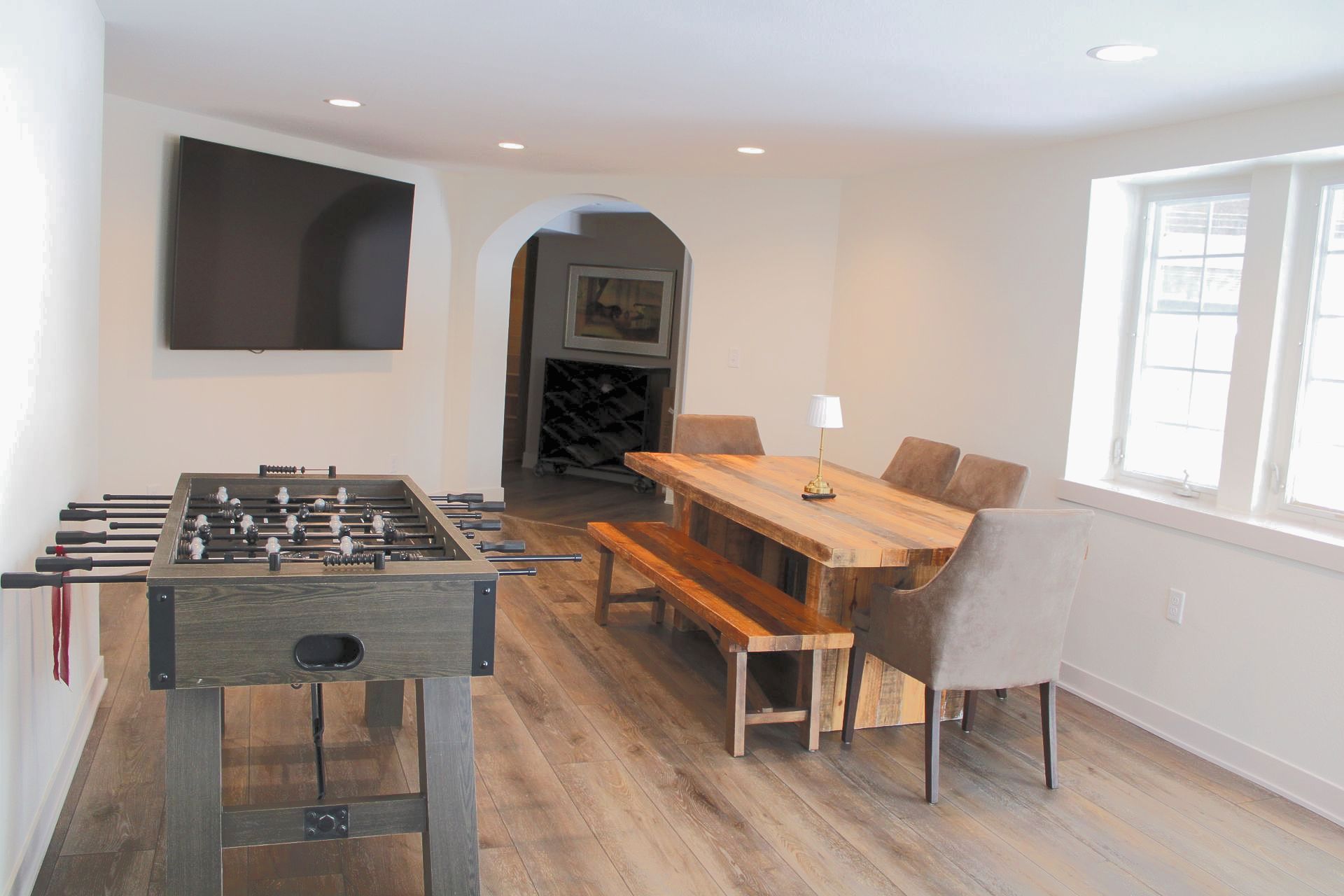 There is a foosball table in the middle of the room.