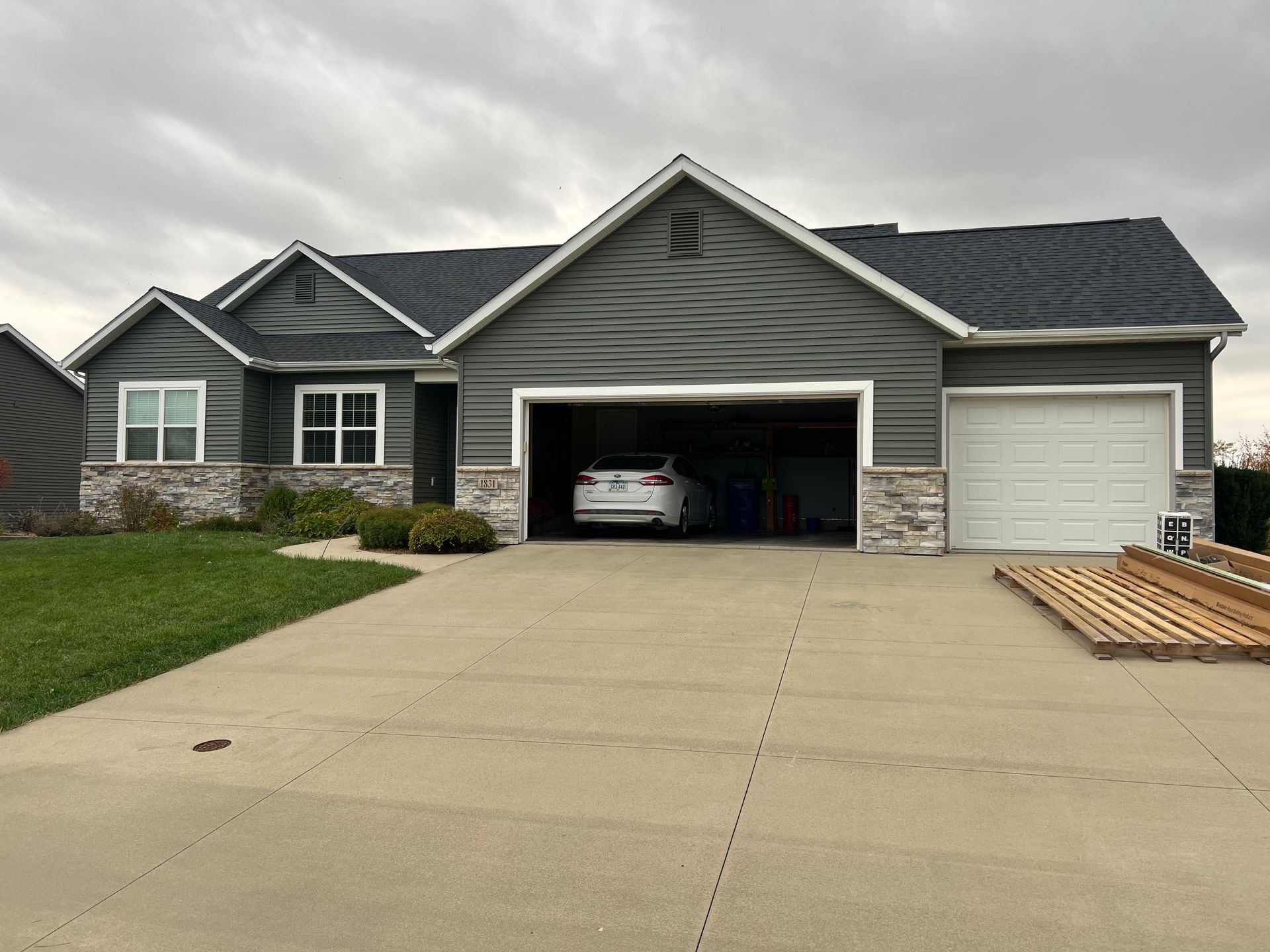 A car is parked in the garage of a house.