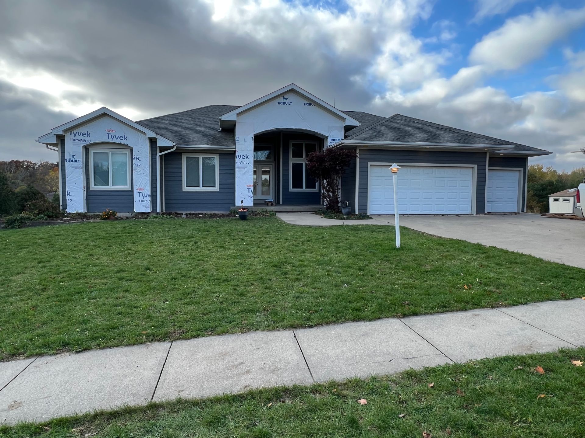 A large house with a lot of grass in front of it.