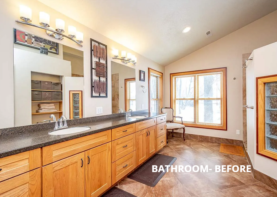A bathroom with two sinks , two mirrors , and wooden cabinets.
