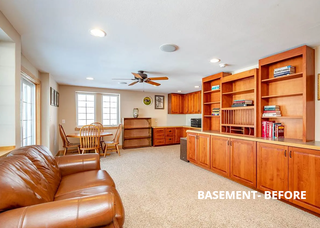 A living room with a couch , chairs , a table and a ceiling fan.