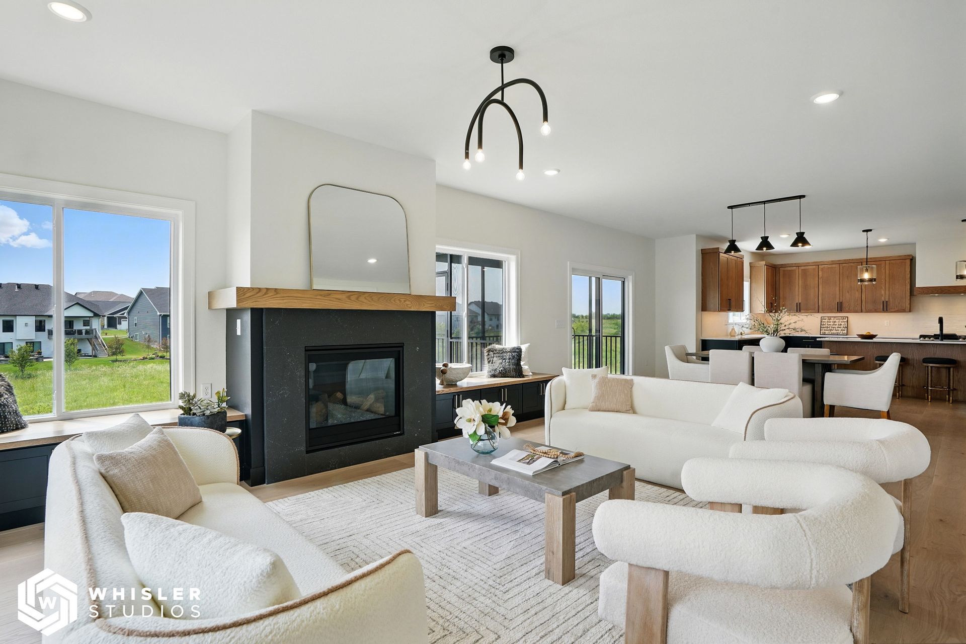 A living room filled with furniture and a fireplace.