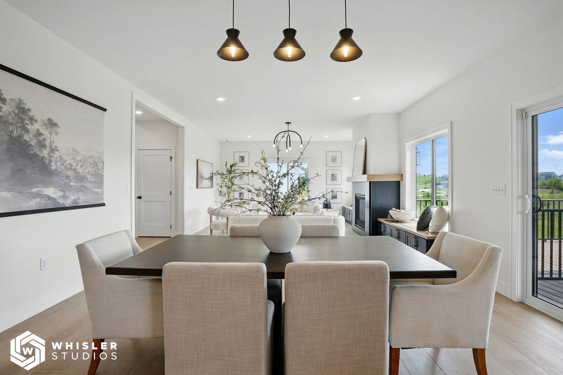 A dining room with a table and chairs and a fireplace