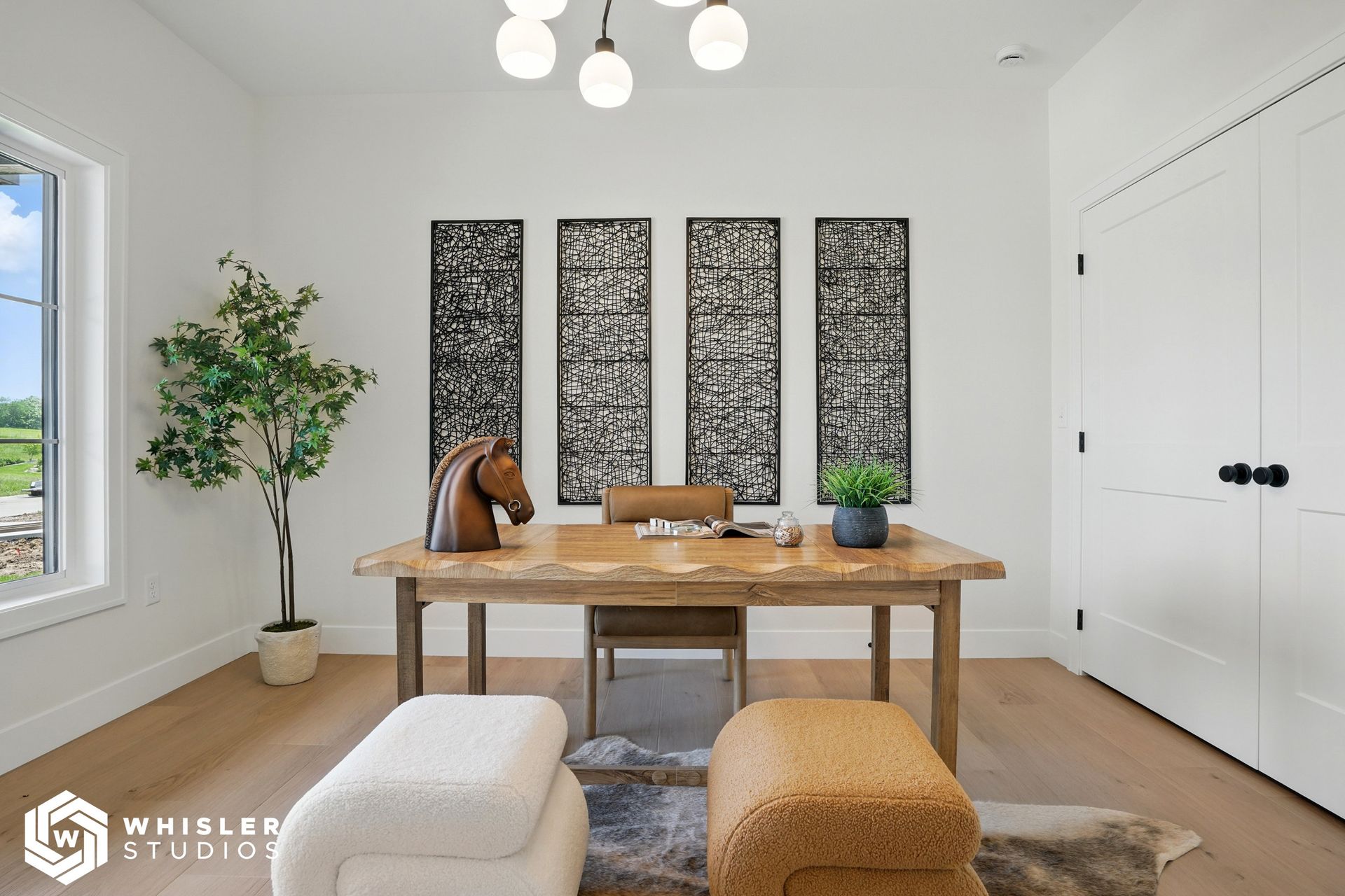 A home office with a wooden desk and chairs