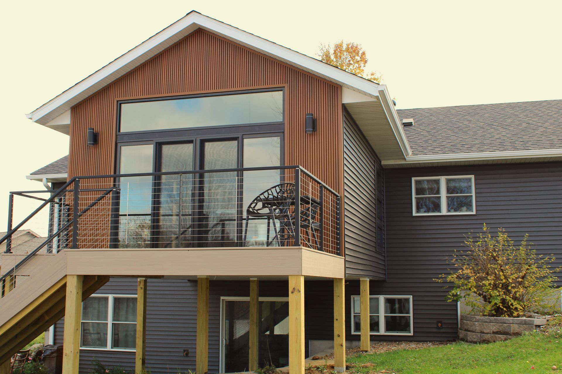 The back of a house with a balcony and stairs