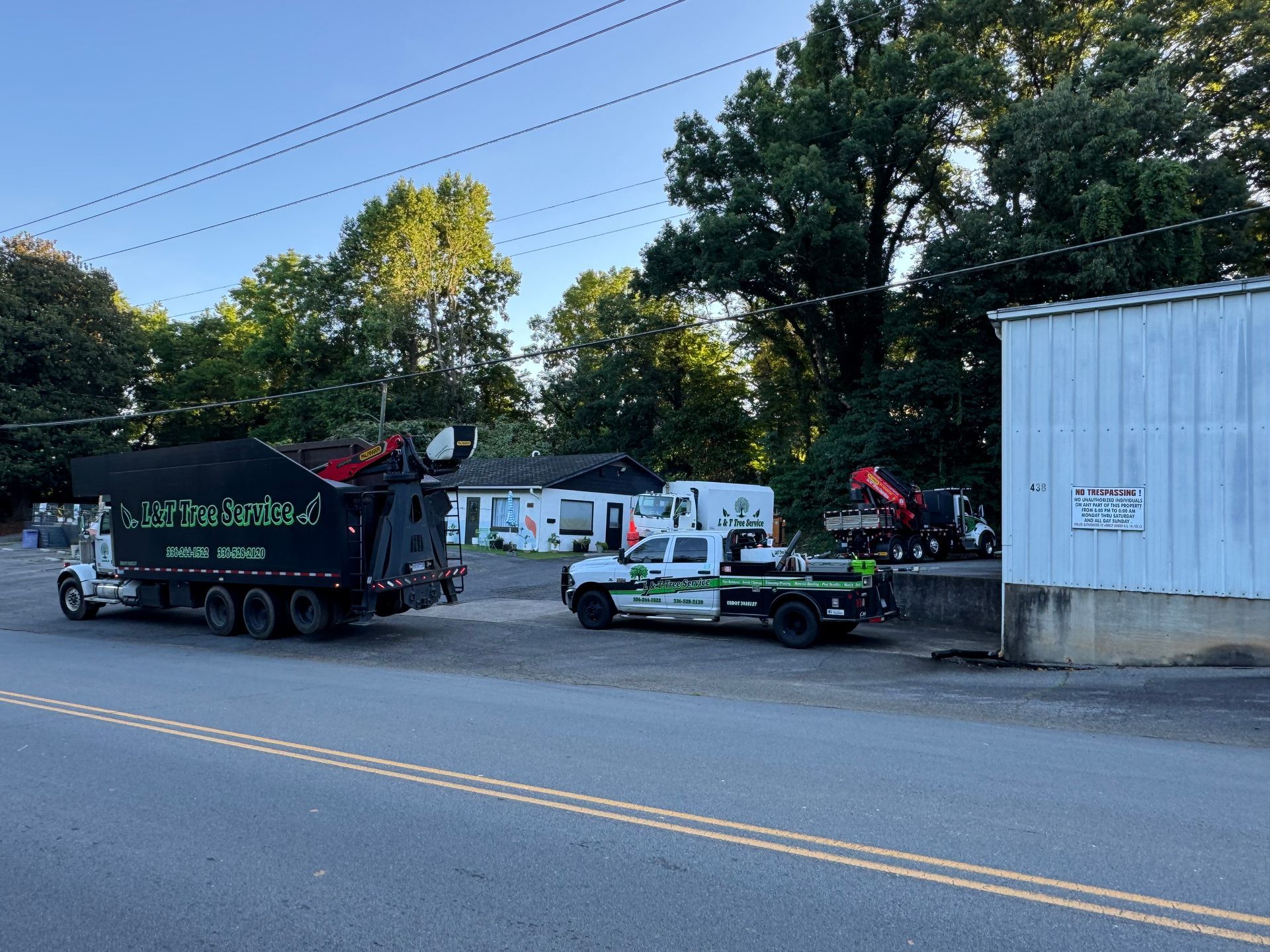 Trucks parked at a business. A large truck is labeled 