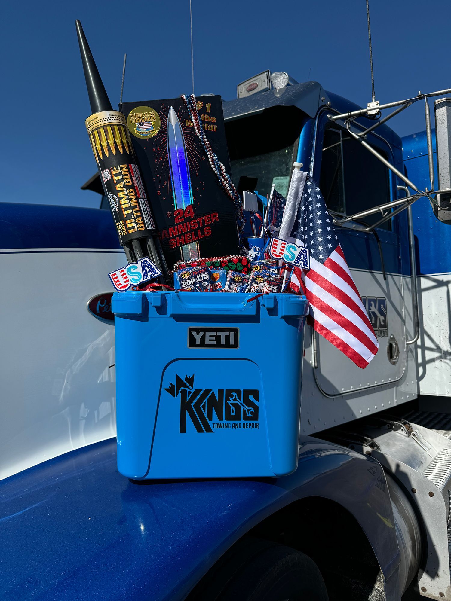 A blue yeti cooler is sitting on the side of a truck