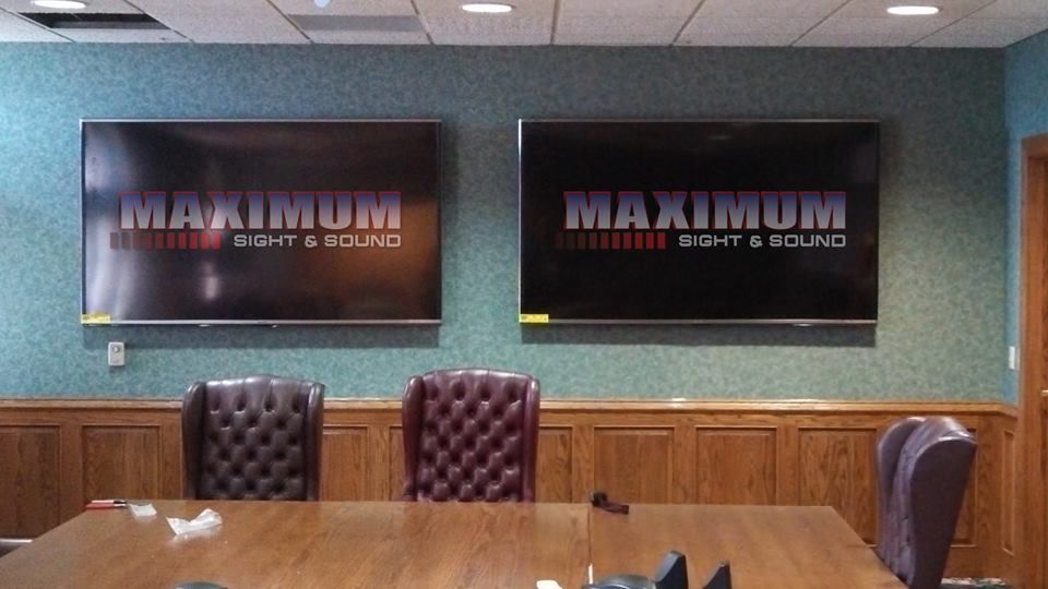 Two mounted TVs displaying