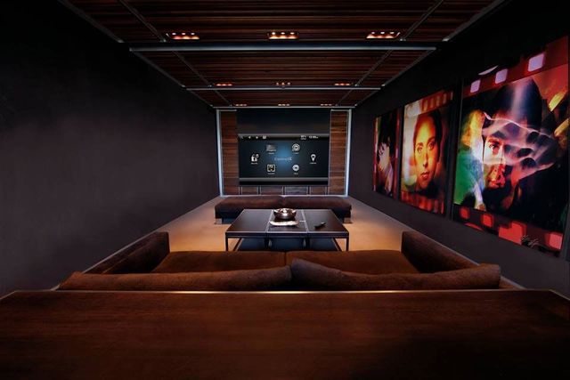 A living room with a couch and a projector screen