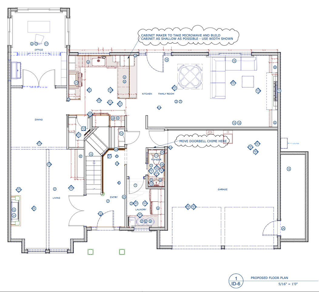 Floor plan of a basement with rooms, furniture, and electrical symbols.