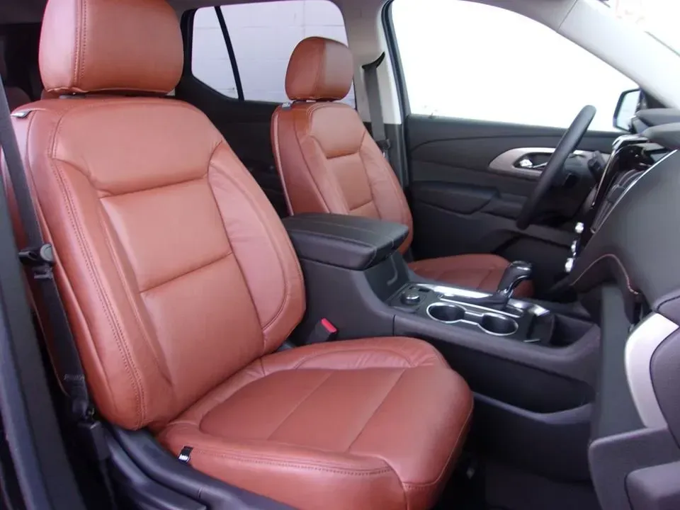 Tan leather car seats and center console inside a modern vehicle interior