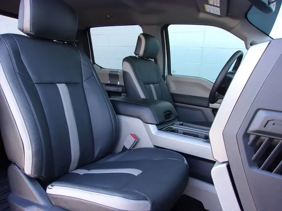 Luxury car interior with black leather seats and center console