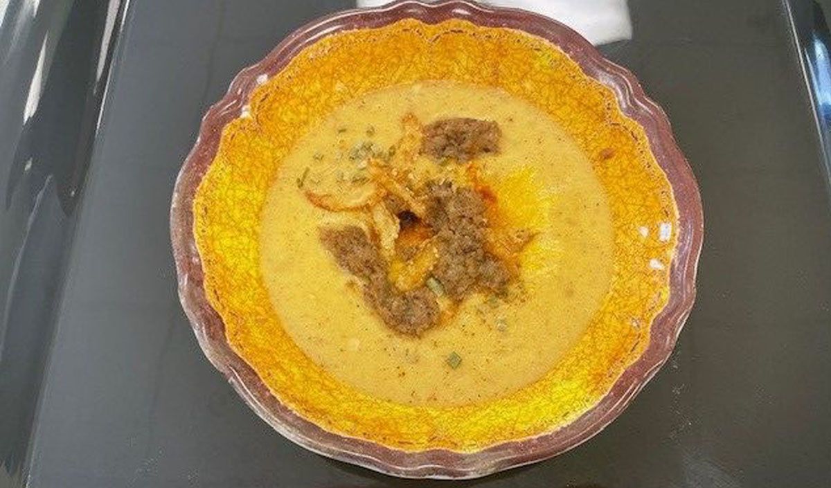 A close up of a pie on a tray on a table.