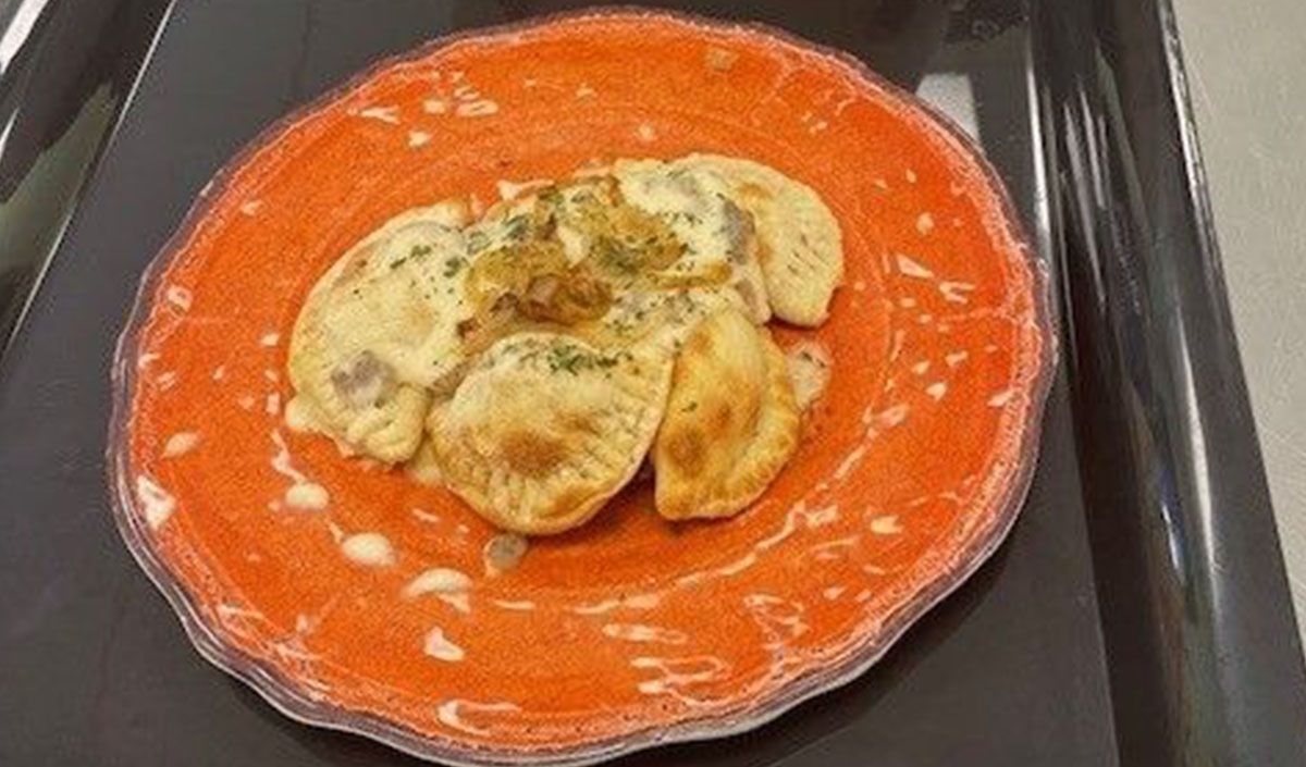 A close up of a plate of food on a tray.