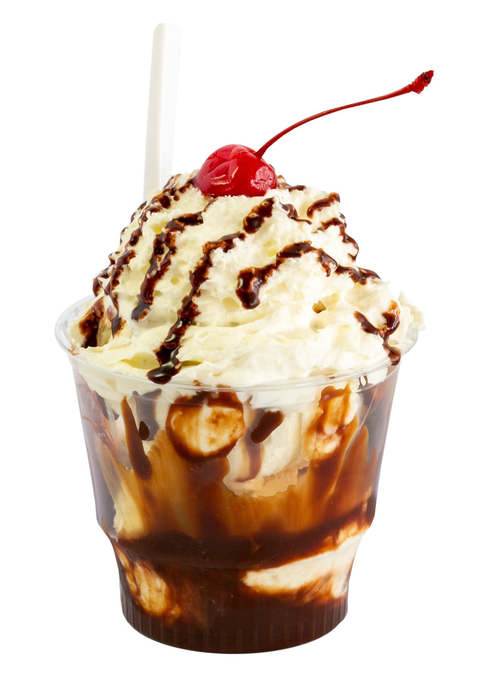 A cup of ice cream with whipped cream and a cherry on top