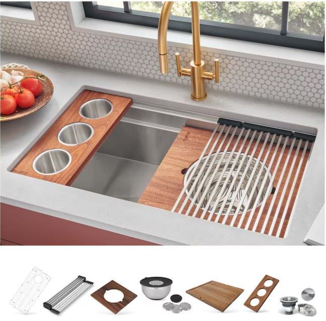 Modern kitchen sink with wooden accessory boards, drainboard, and brass faucet