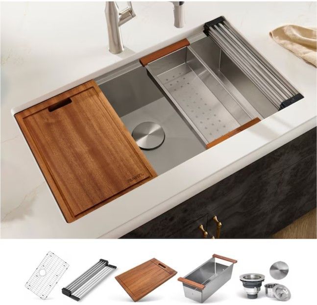 Modular kitchen sink with sliding cutting board, dish rack, and metal colander accessories