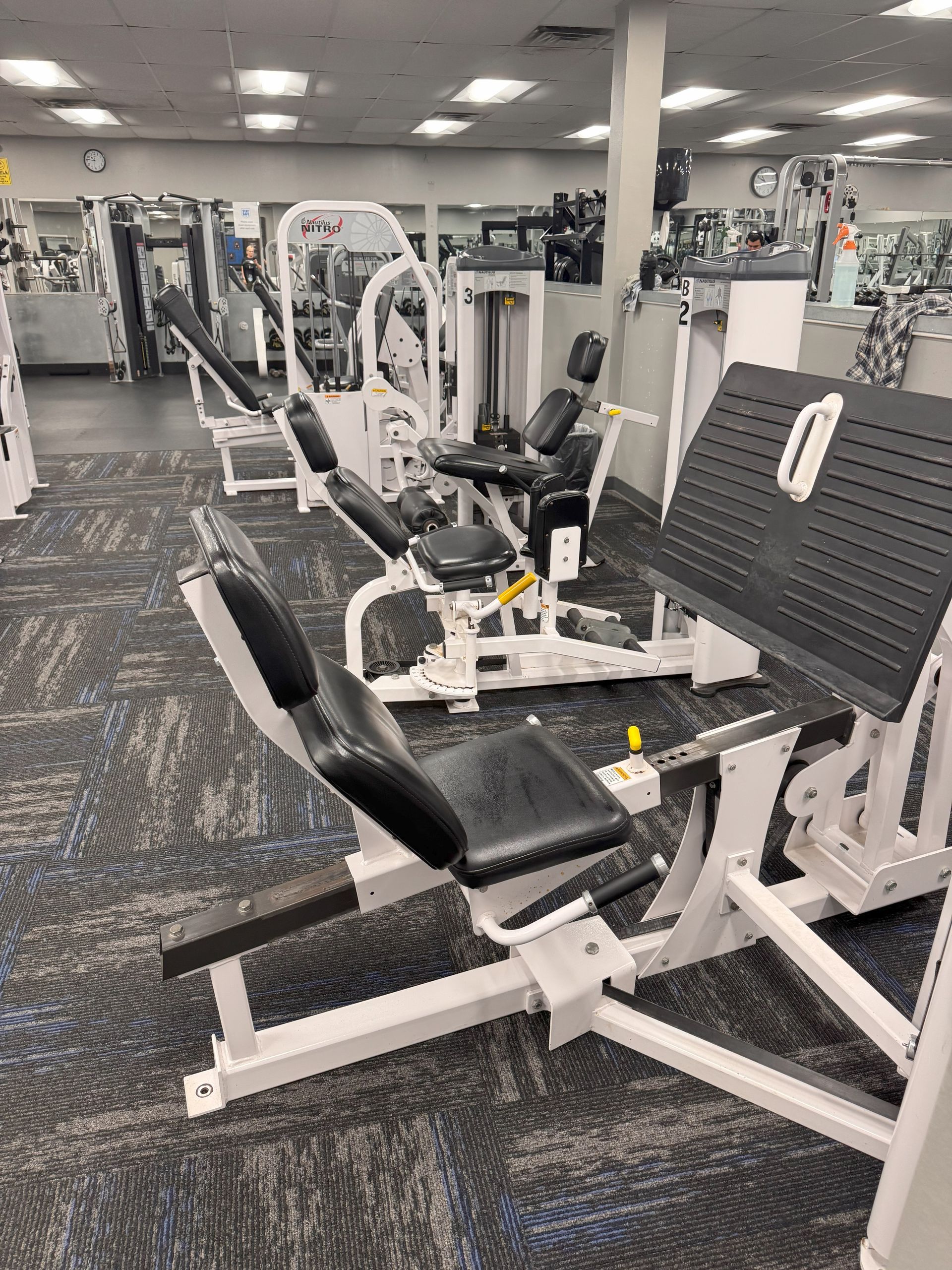 A gym filled with lots of exercise equipment