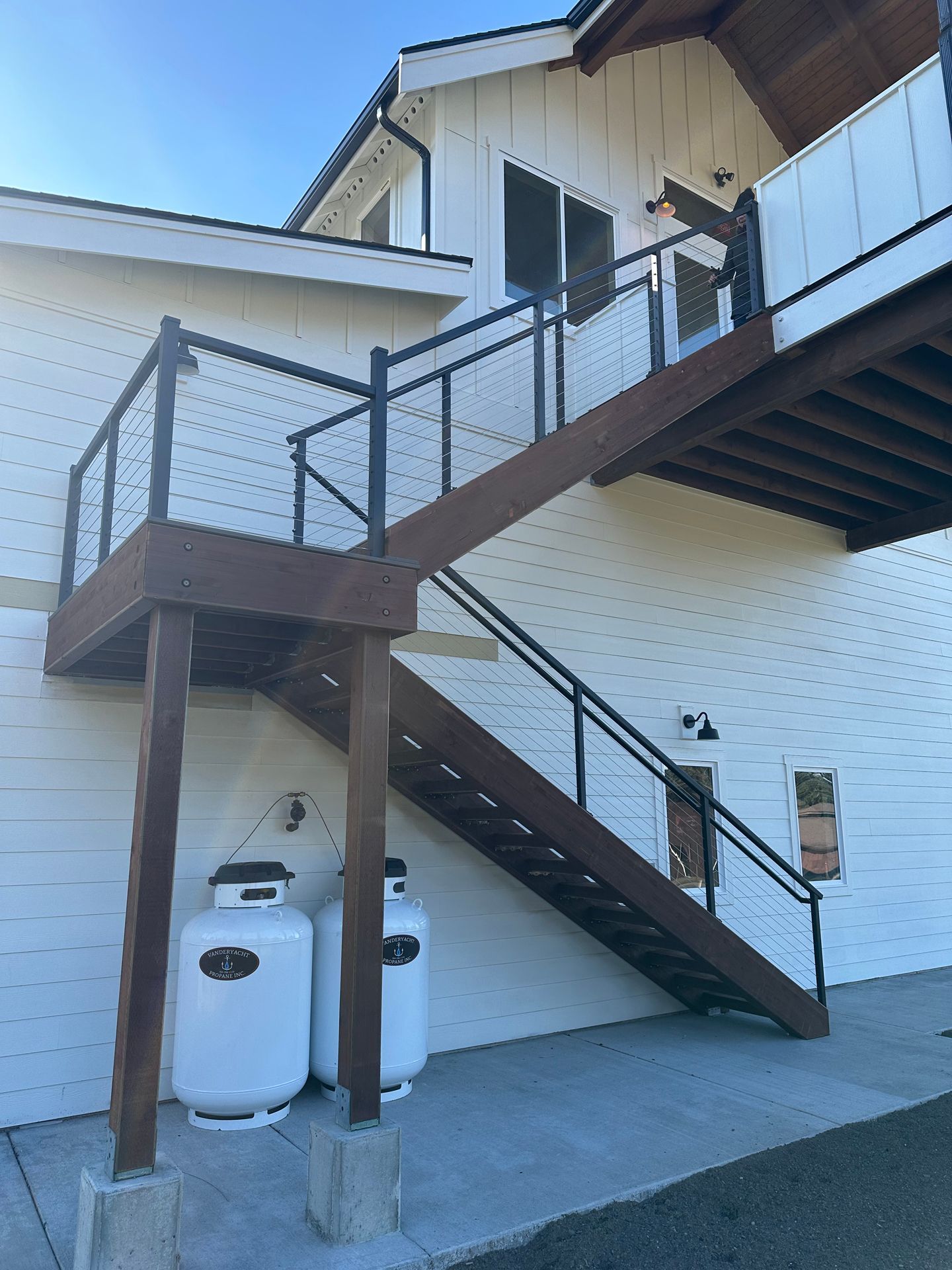 Newly brown stairs with cable railings