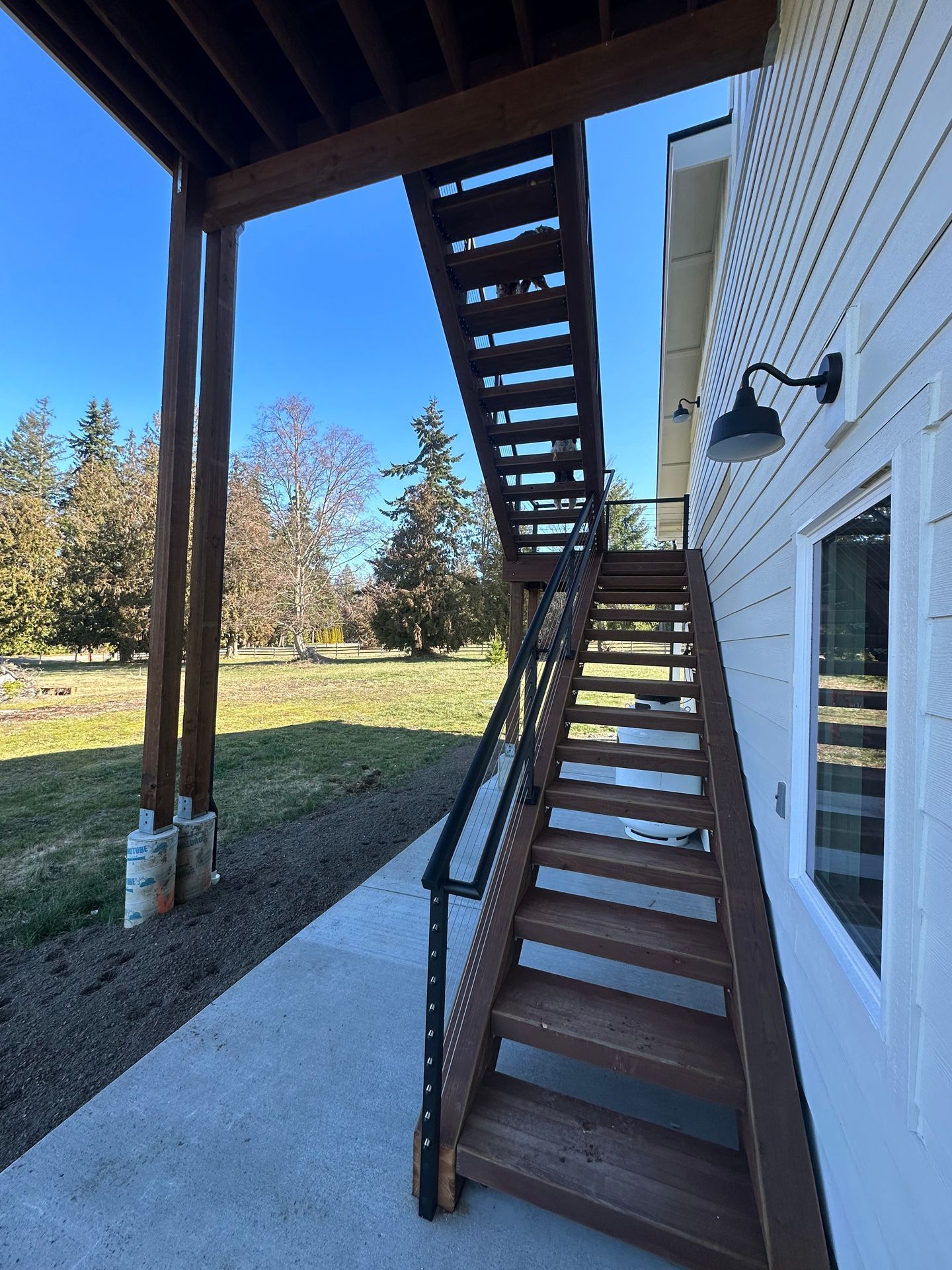Brown stairs with cable railings