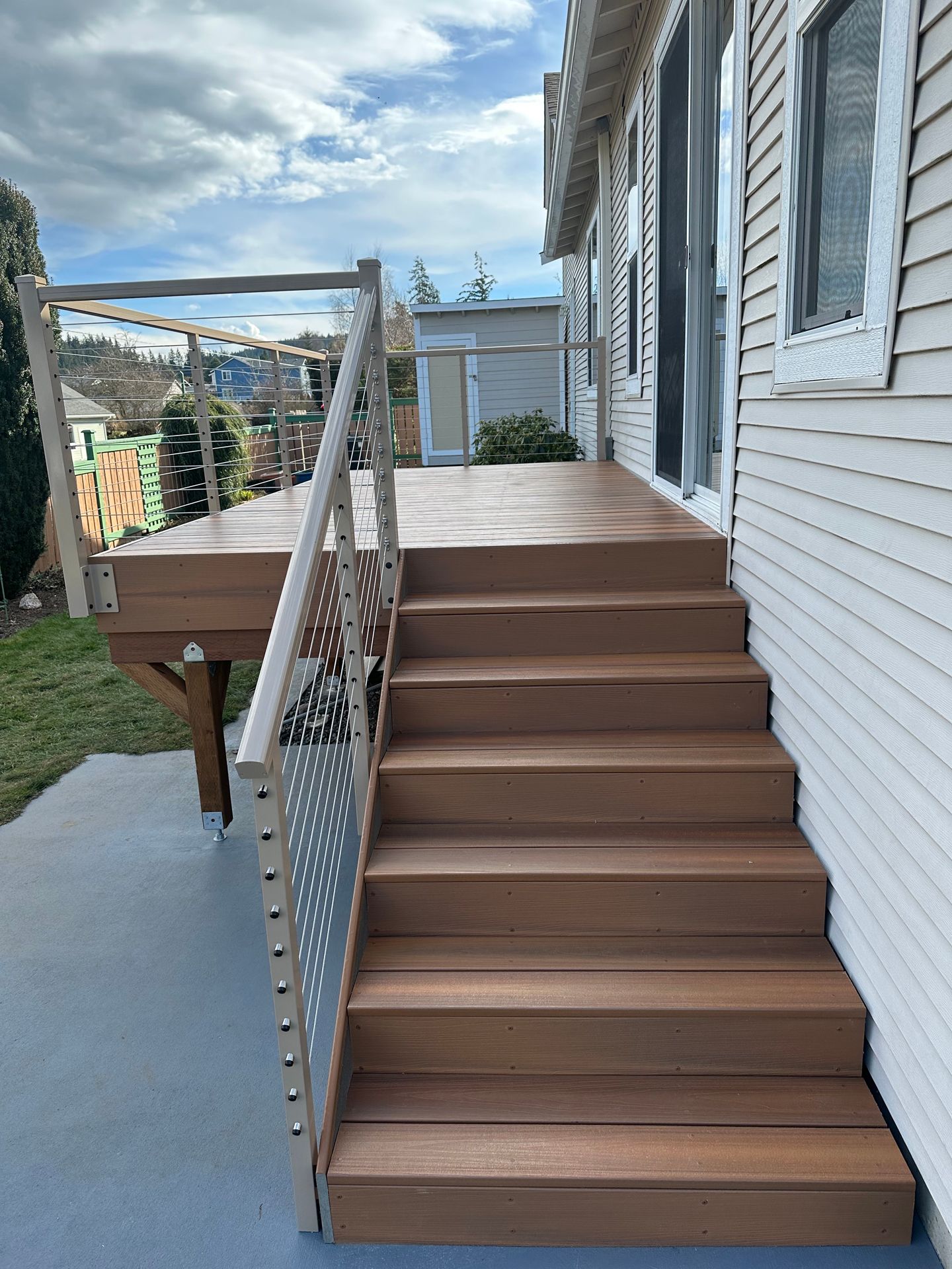 Newly custom-built brown stairs & railing