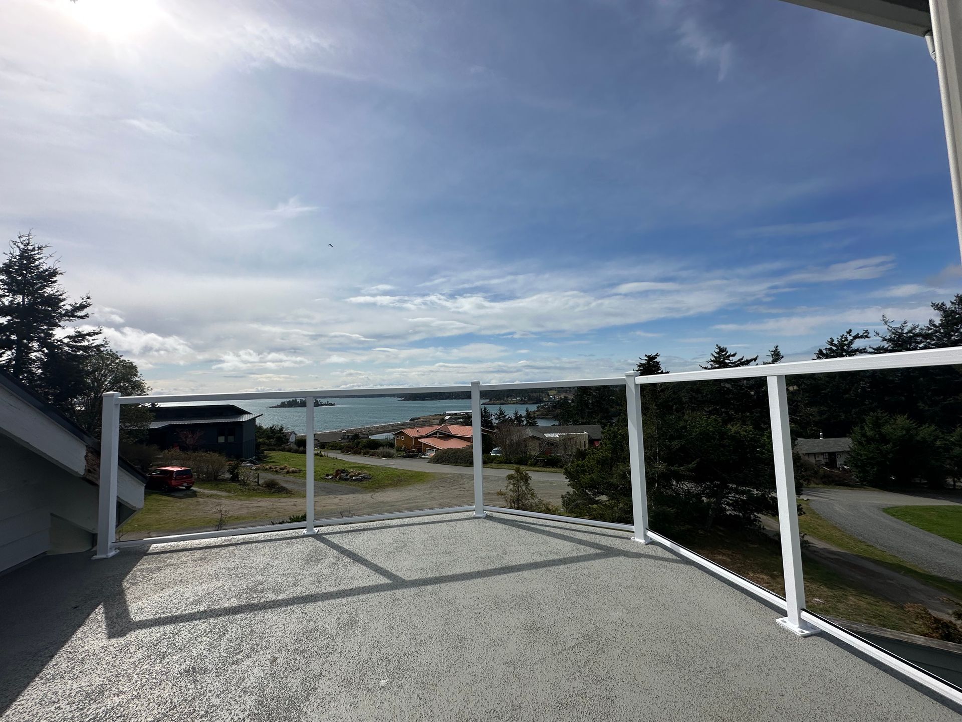 Newly installed white glass railing