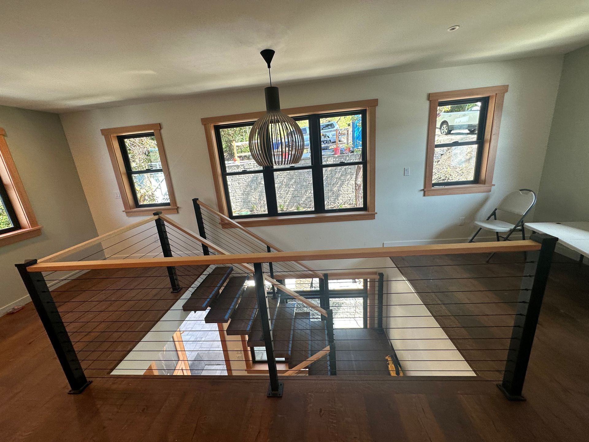 Newly built wood stair with cable railings