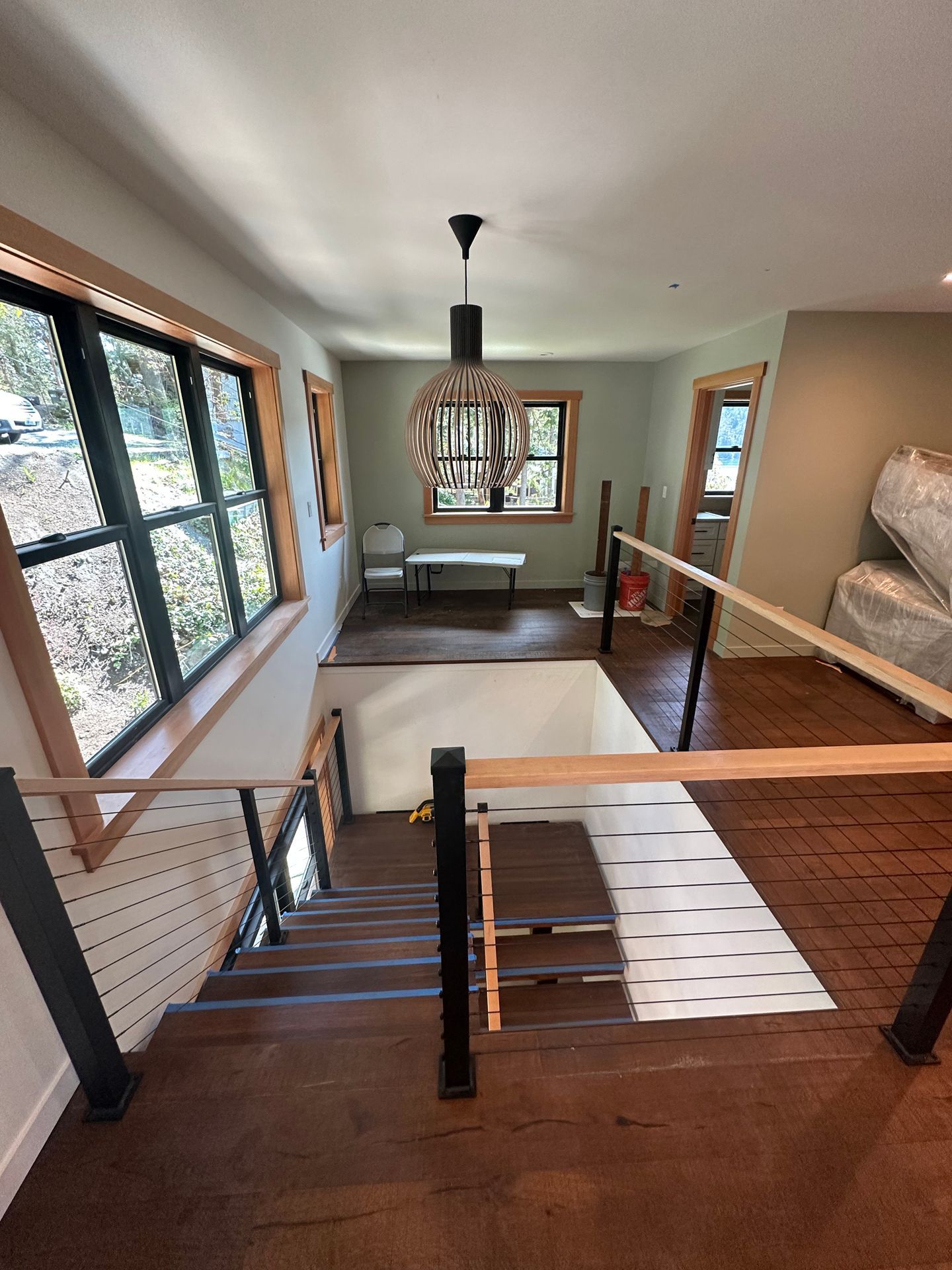 Custom-built wood stair with cable railings