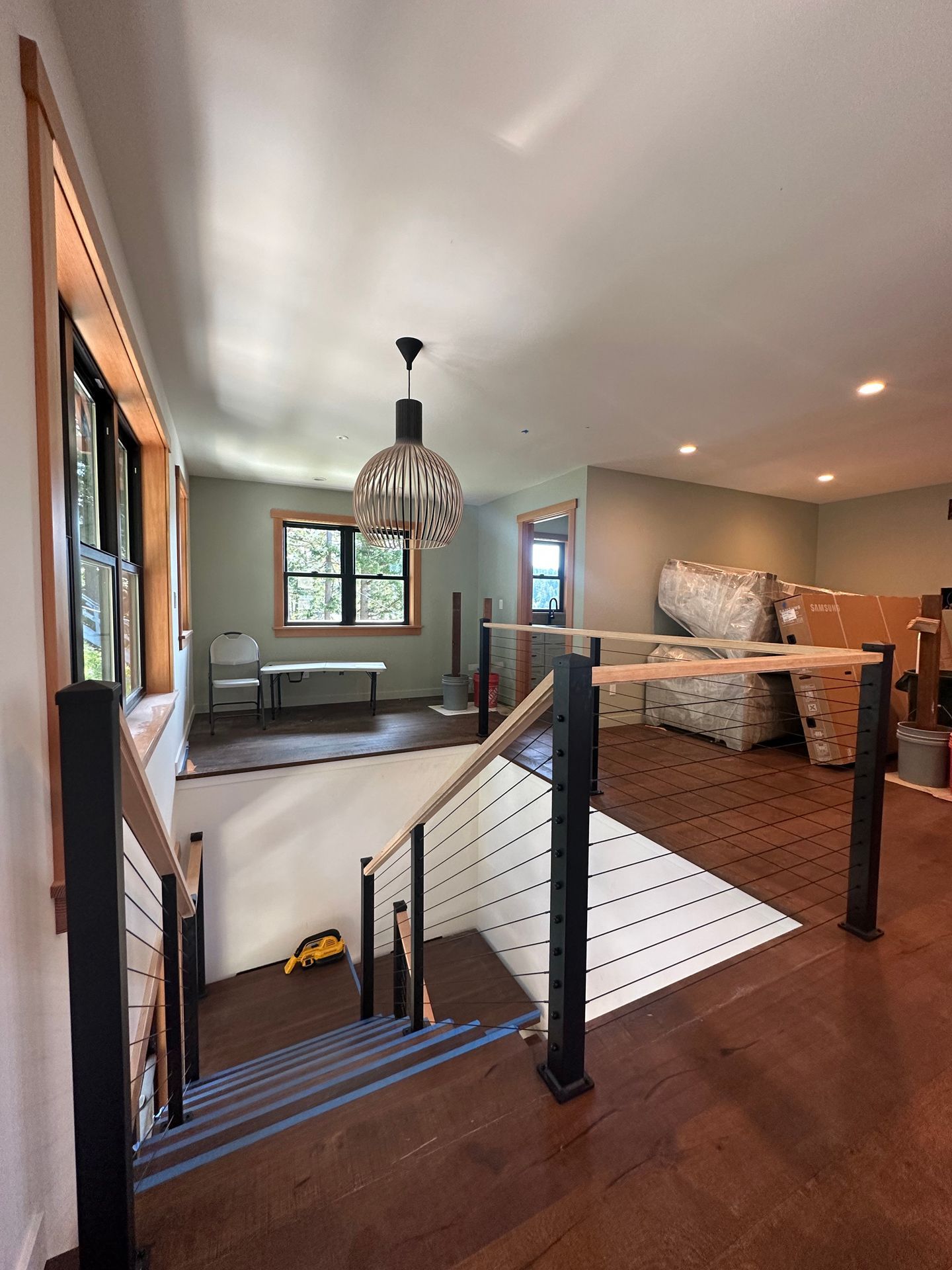 Custom-built wood stair with cable railing