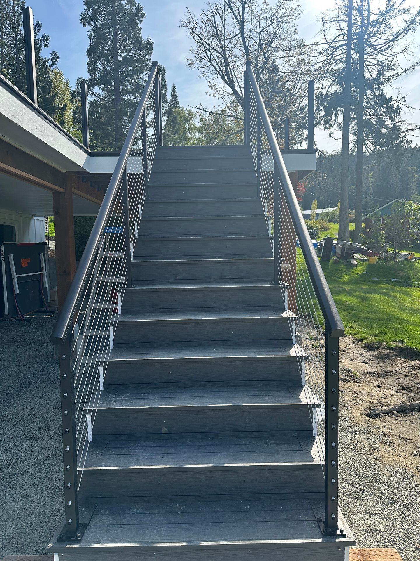 Black stairs with cable railing