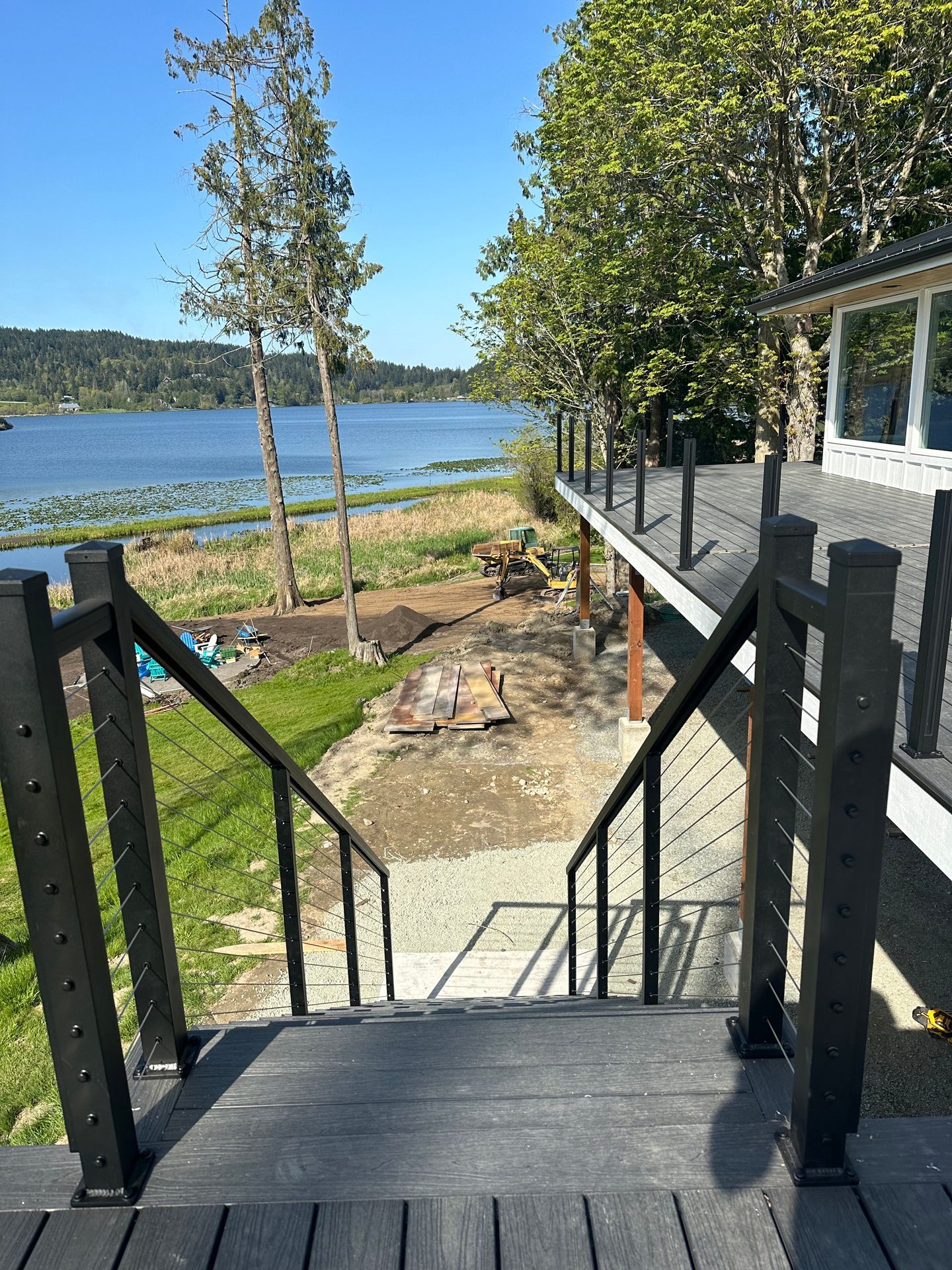 Black stairs with cable railings