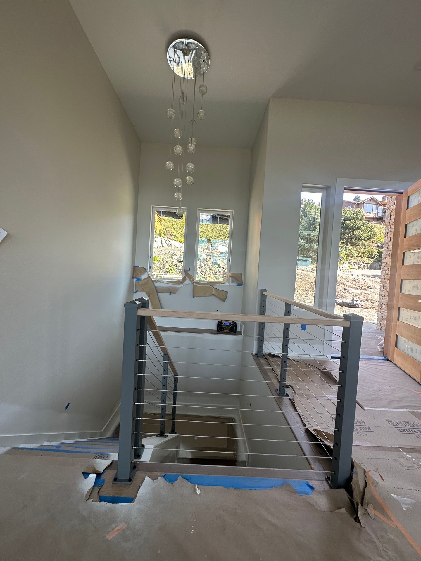 Wood stair with gray railing installation