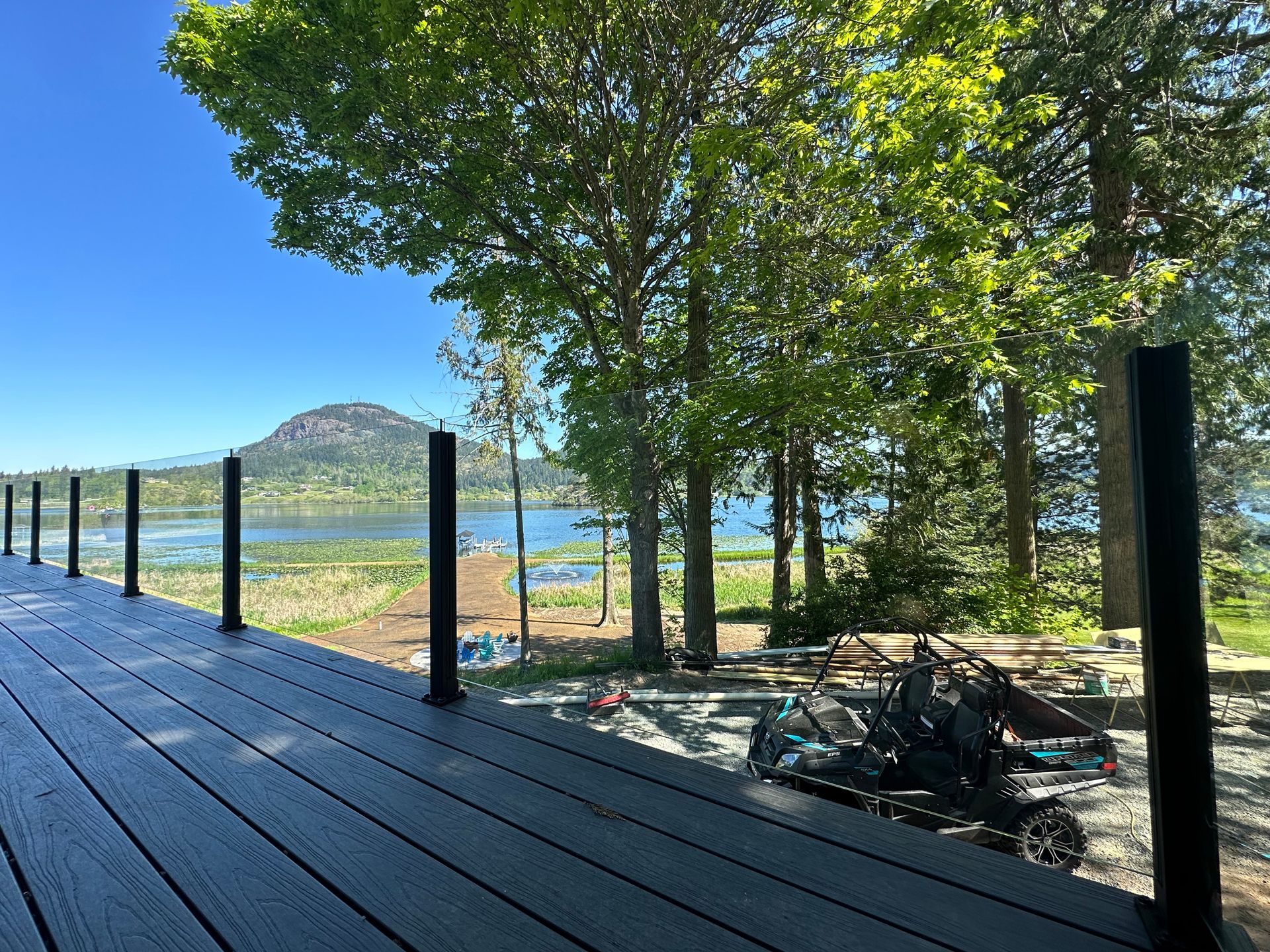 Newly installed deck floor and glass railing