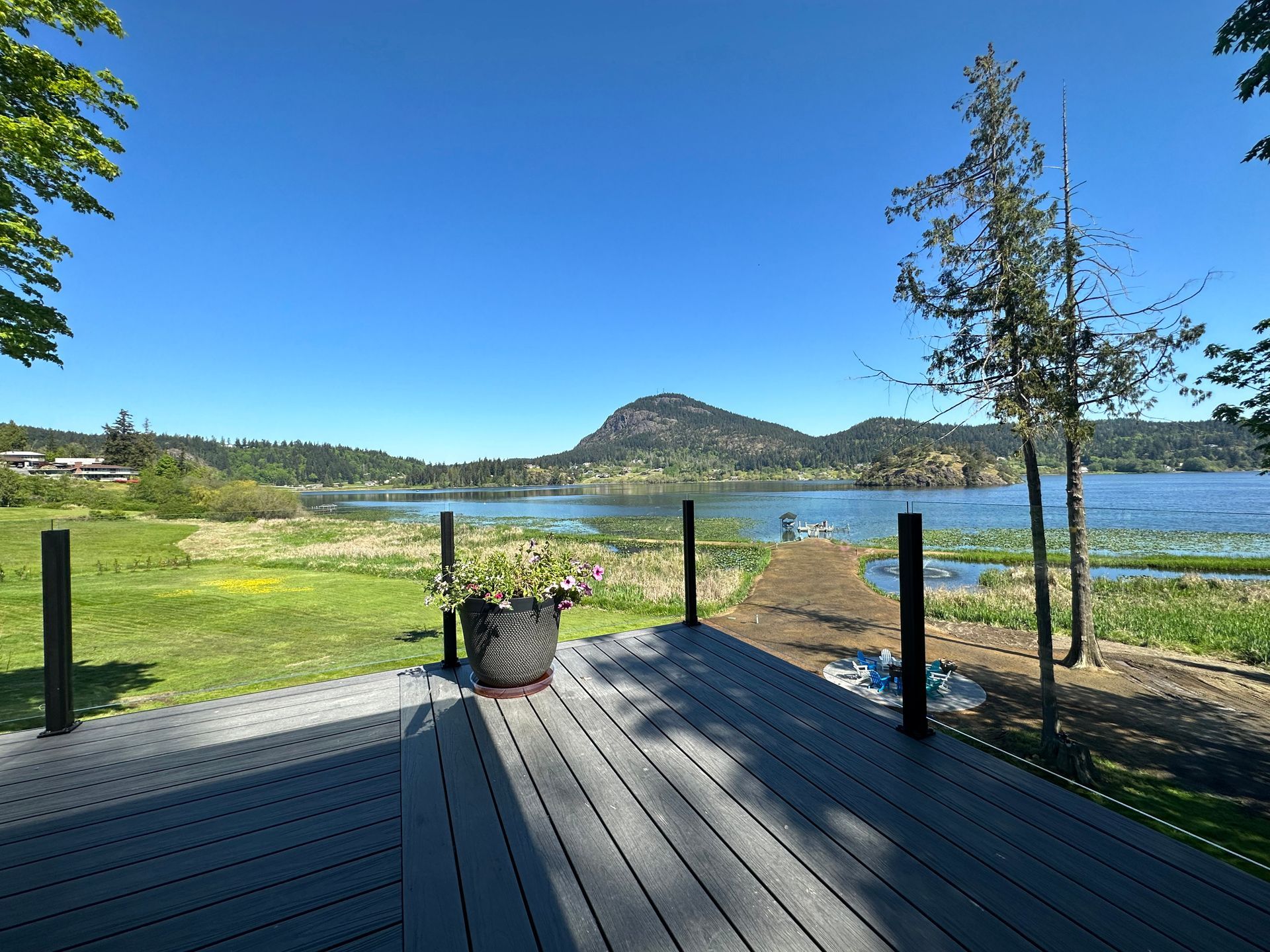 Newly installed deck floor and glass railings