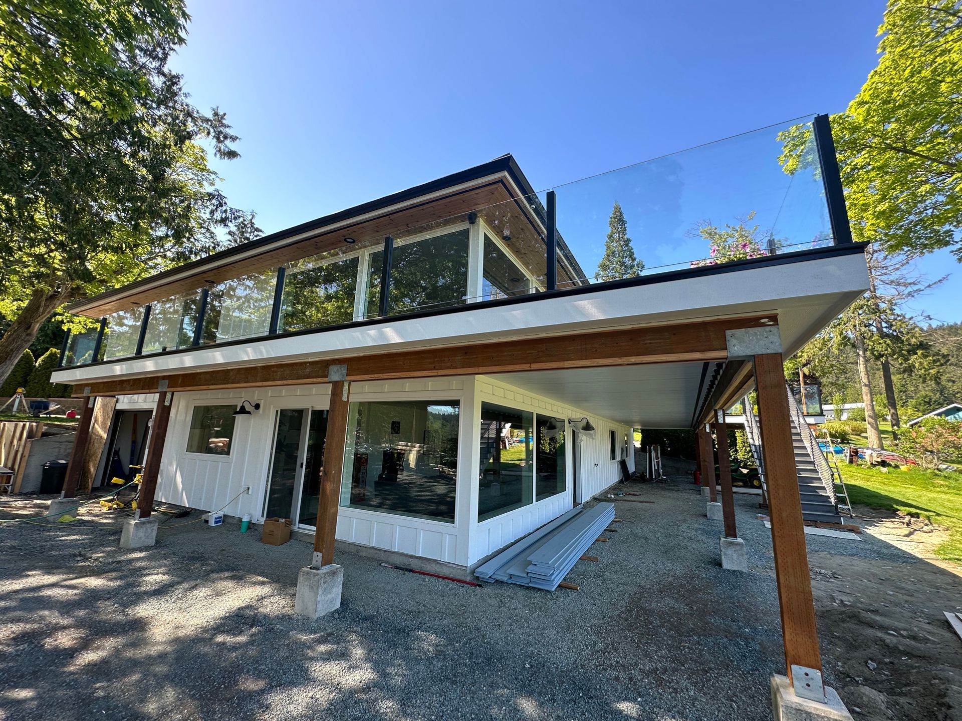Custom-built glass railing with black post